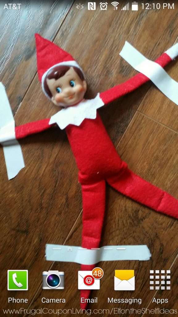 Elf-on-the-shelf-ideas-elf-stuck-in-the-phone-frugal-coupon-living-url