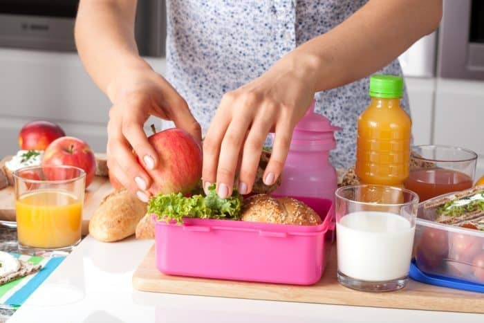Lunch Box Ideas or Kids - Mother Packing a Lunch Box