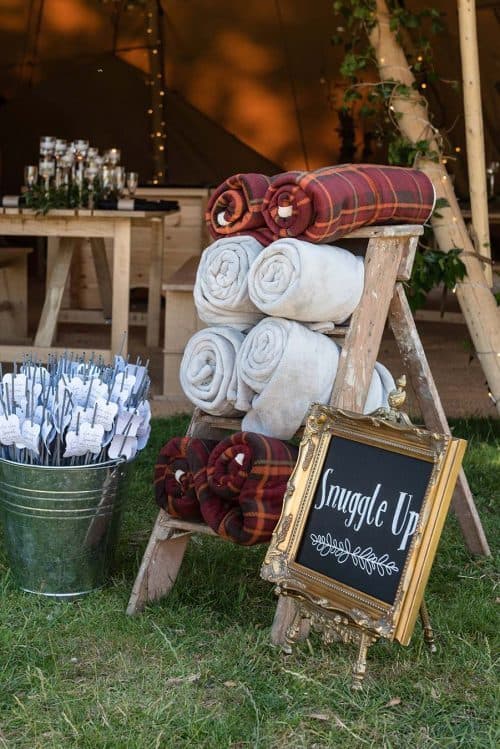 Cheap Outdoor Wedding Decor Ideas | Snuggle Up Blanket Display