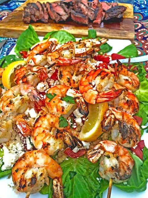 Greek-Style Grilled Shrimp on a Dish with Greens