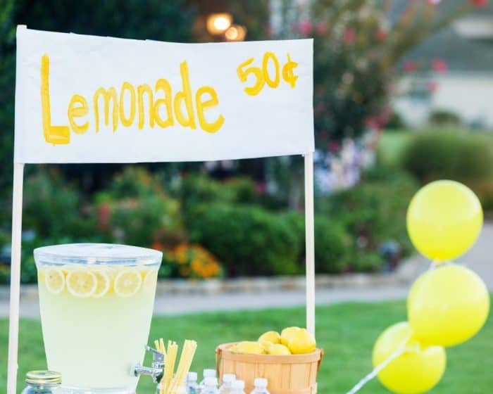 cute lemonade stand in front yard