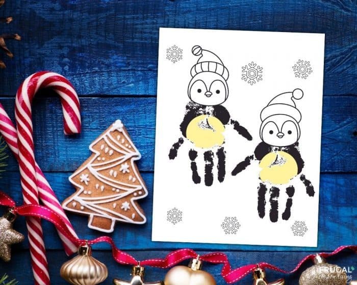 how to make penguin Christmas handprints