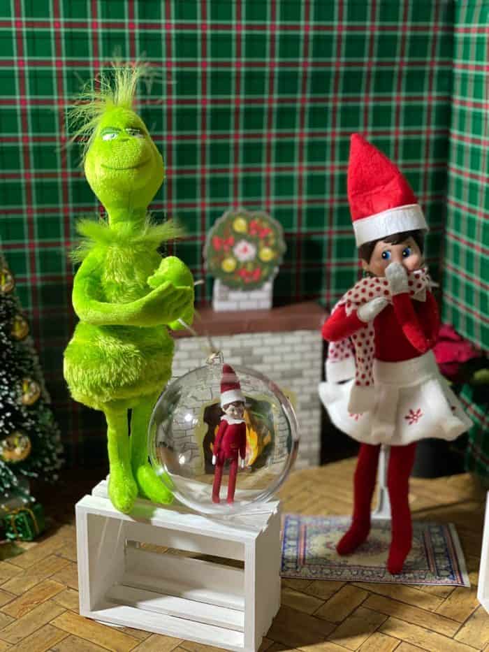 miniature elf on the shelf trapped by the grinch