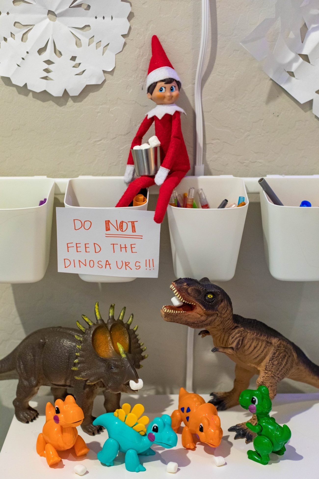 elf on the shelf dinosaur feeding mini marshmallows