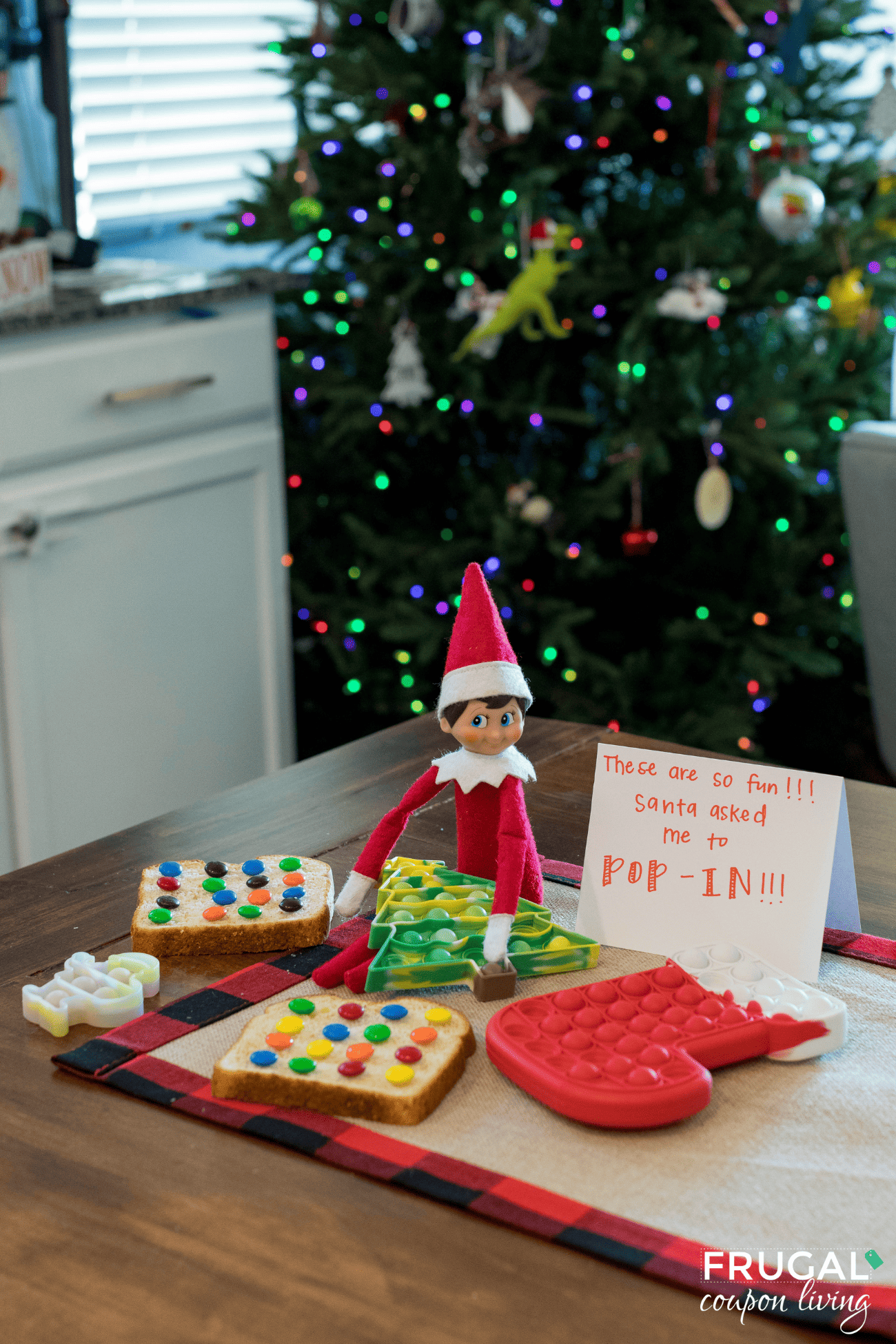 cute elf on the shelf poppers toy made out of bread and m&Ms